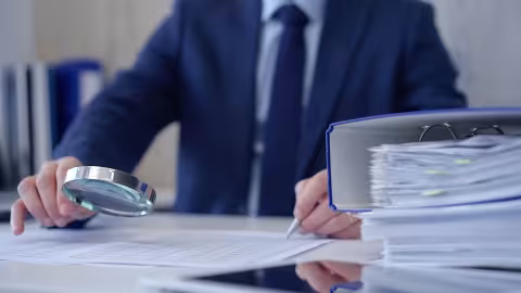 A person inspecting documents.